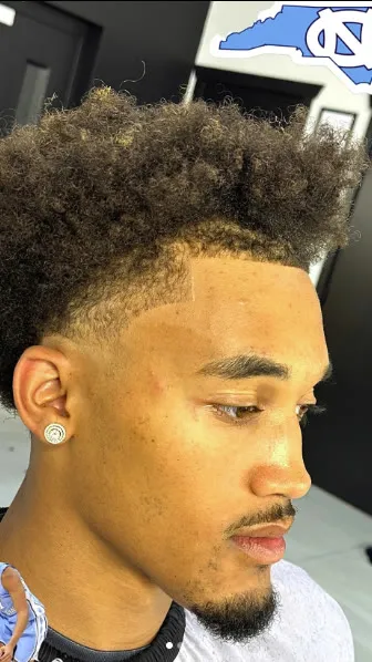 High fade with textured curls on Seth Trimble, UNC Tar Heels